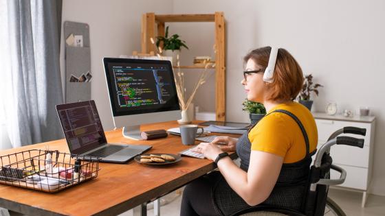 Woman in wheelchair working from home