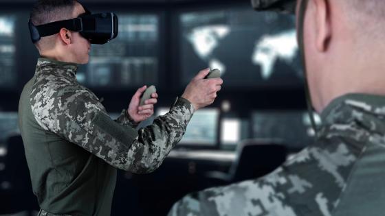 Soldier wearing VR headset training to pilot drone